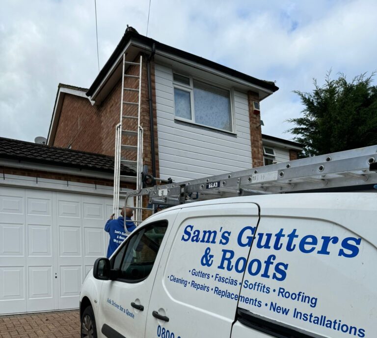 Roofer is setting up the ladder